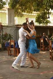 a couple dancing in the street